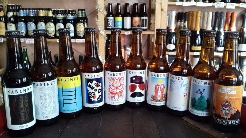 Bottled craft beers from Kabinet Brewery displayed on a shelf in Belgrade, Serbia