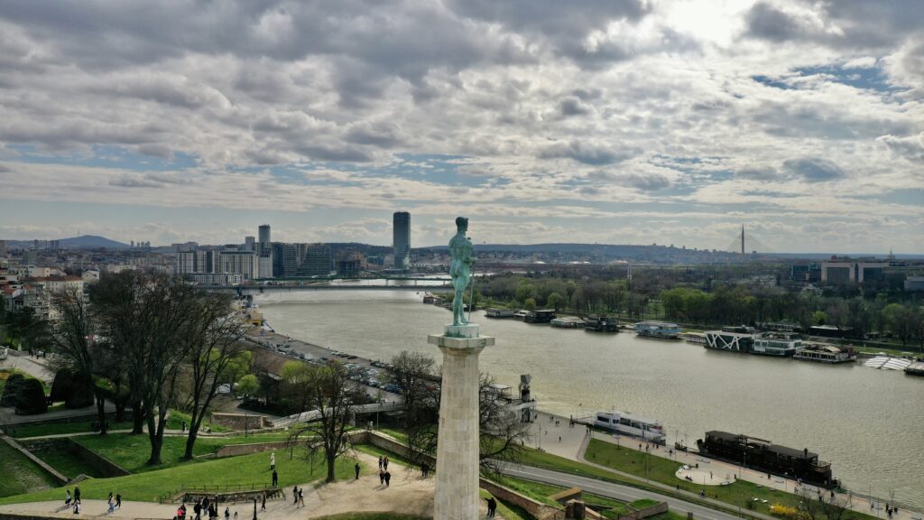 Travel Guide to Serbia: Kalemegdan Fortress in Belgrade overlooking the confluence of the Sava and Danube rivers, with the Pobednik monument in the foreground