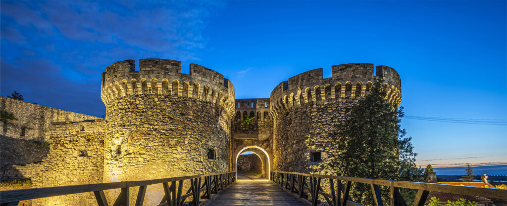 Belgrade Fortress at night illuminated with lights — one of the top Belgrade attractions